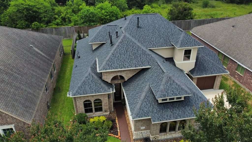 Executive Roofing team performing roof repairs on a residential property in Spring
